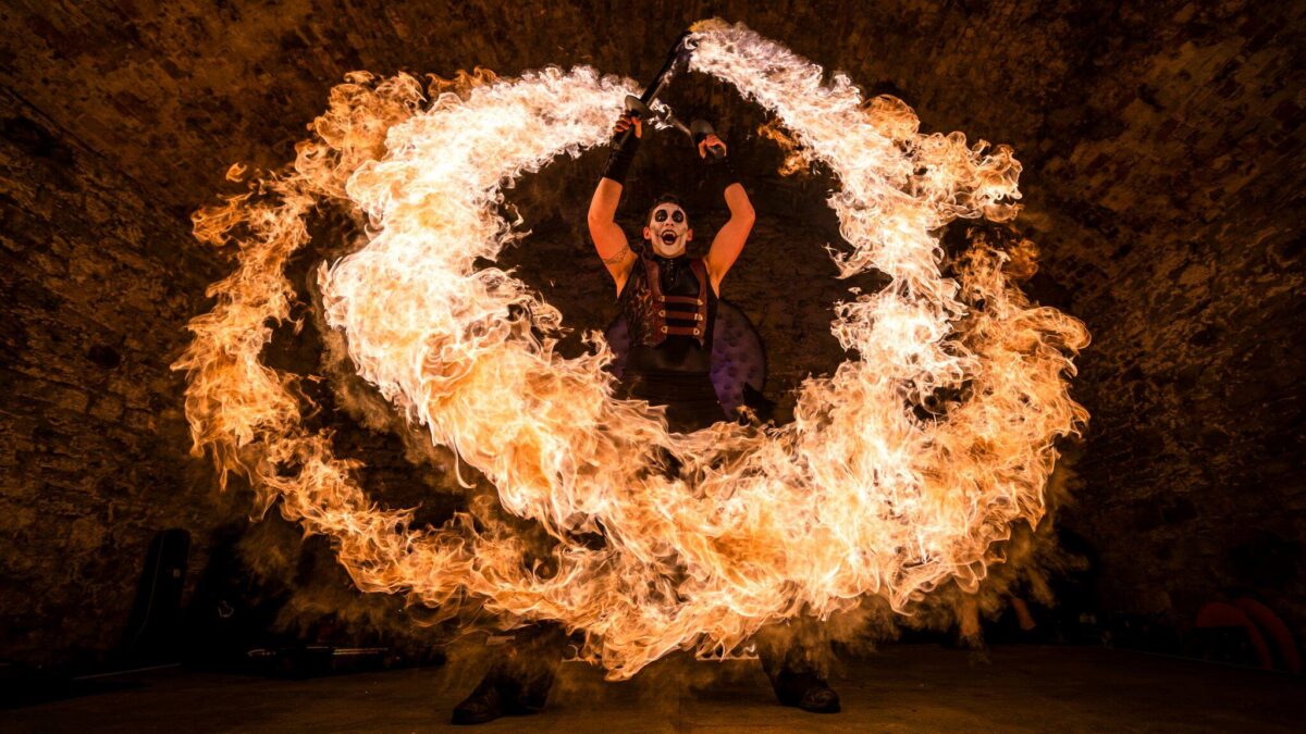 Fire performer with a circle of fire around him