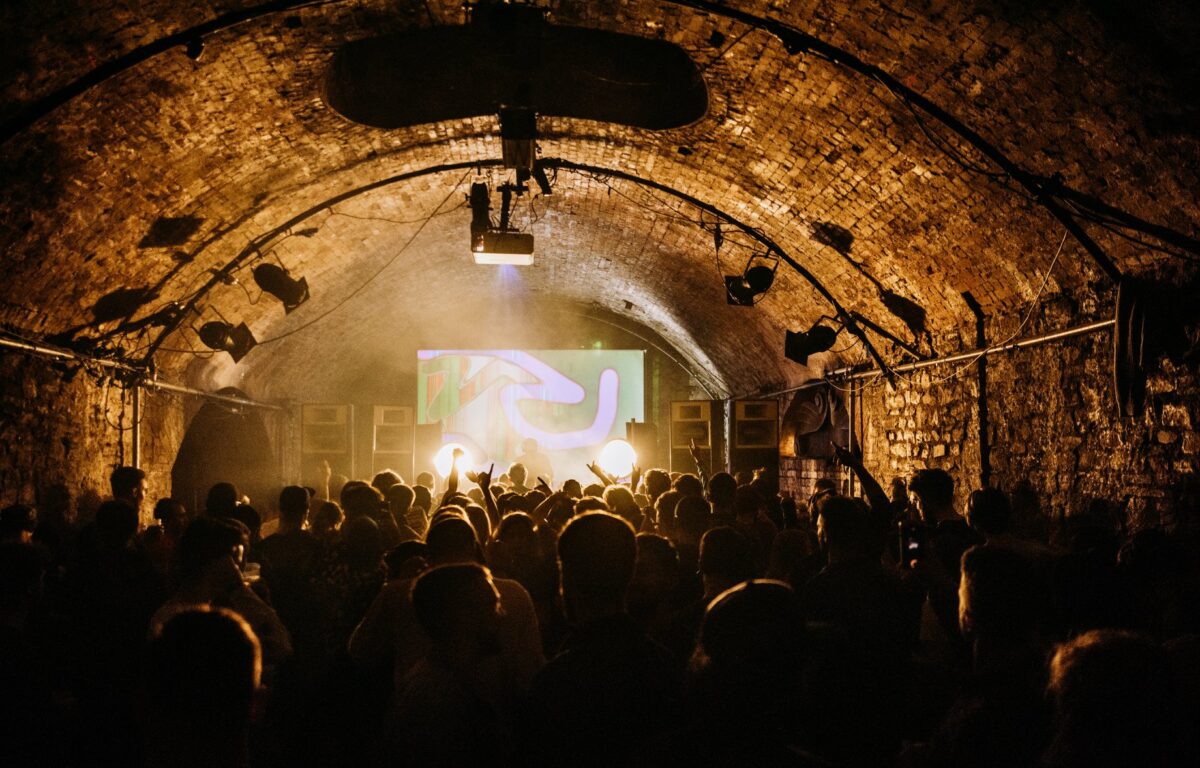 crowd looking at stage in tunnels