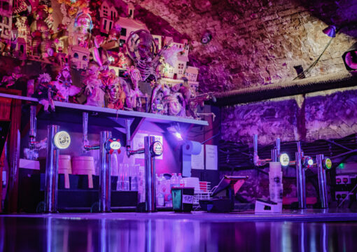 A close up photo of the beer taps at in the Loco Klub bar.